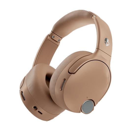 Beige over-ear headphones on a black background | Primer