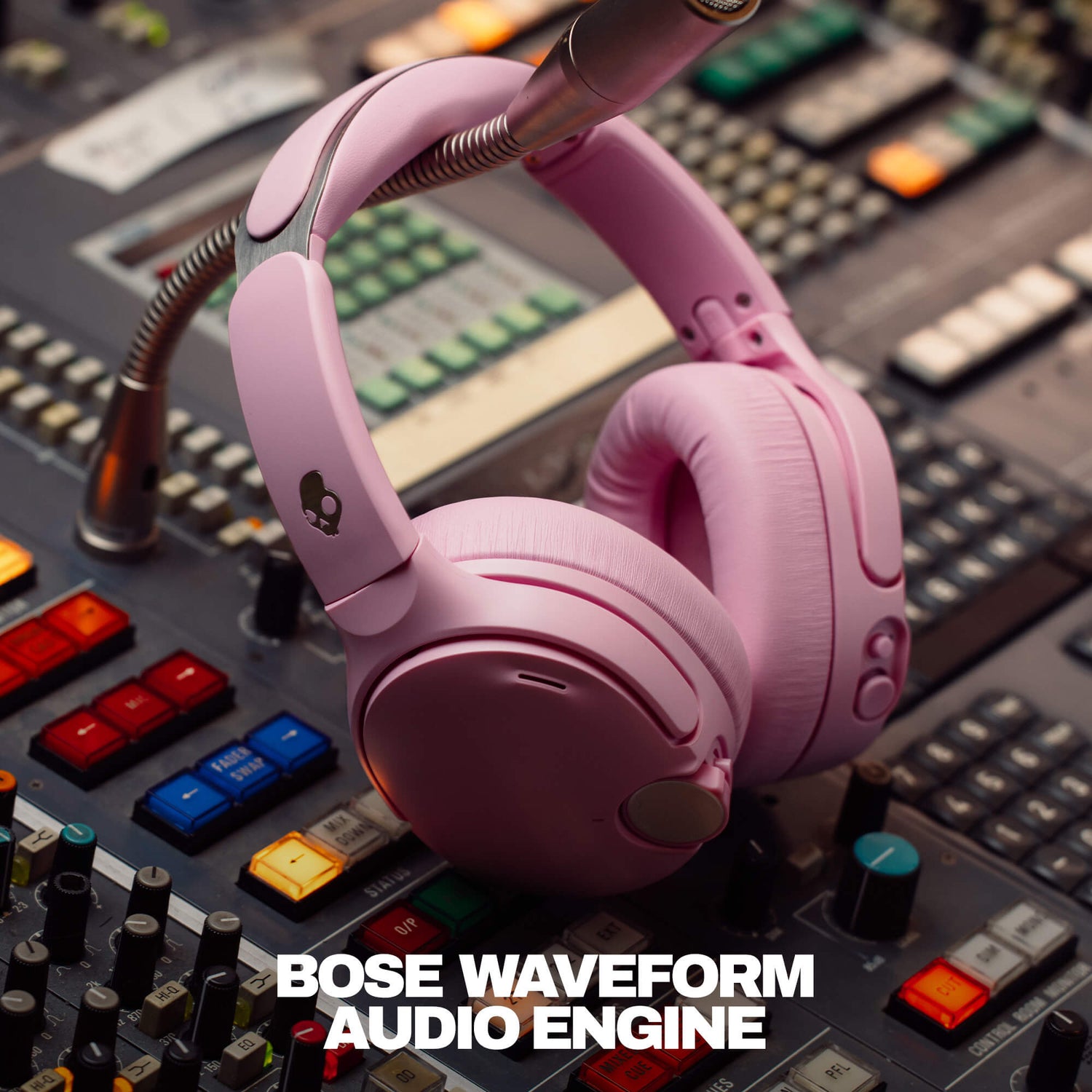 Pink headphones on a mixing console with 'Bose Waveform Audio Engine' text |  Candy
