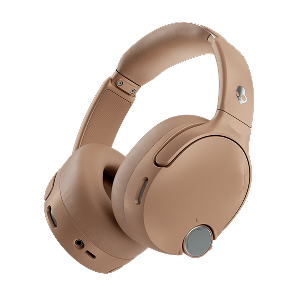 Beige over-ear headphones on a black background | Primer
