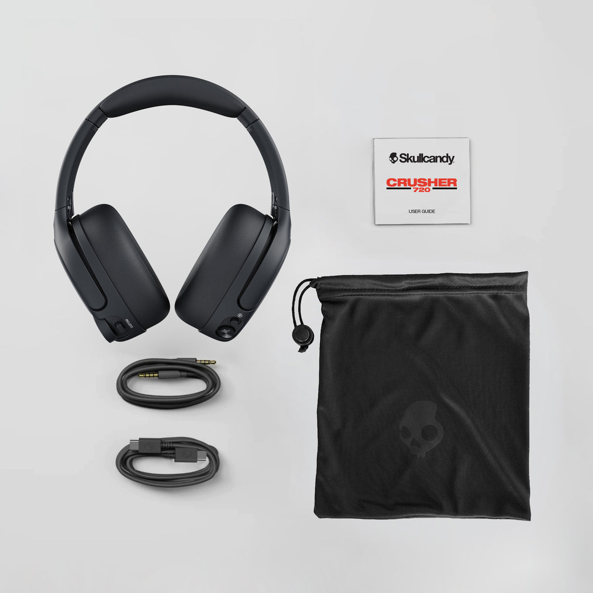 Skullcandy Crusher Pro headphones with accessories on a light gray background | Leopard