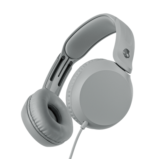 White over-ear wired headphones shown at an angle against a solid black background. | Cement