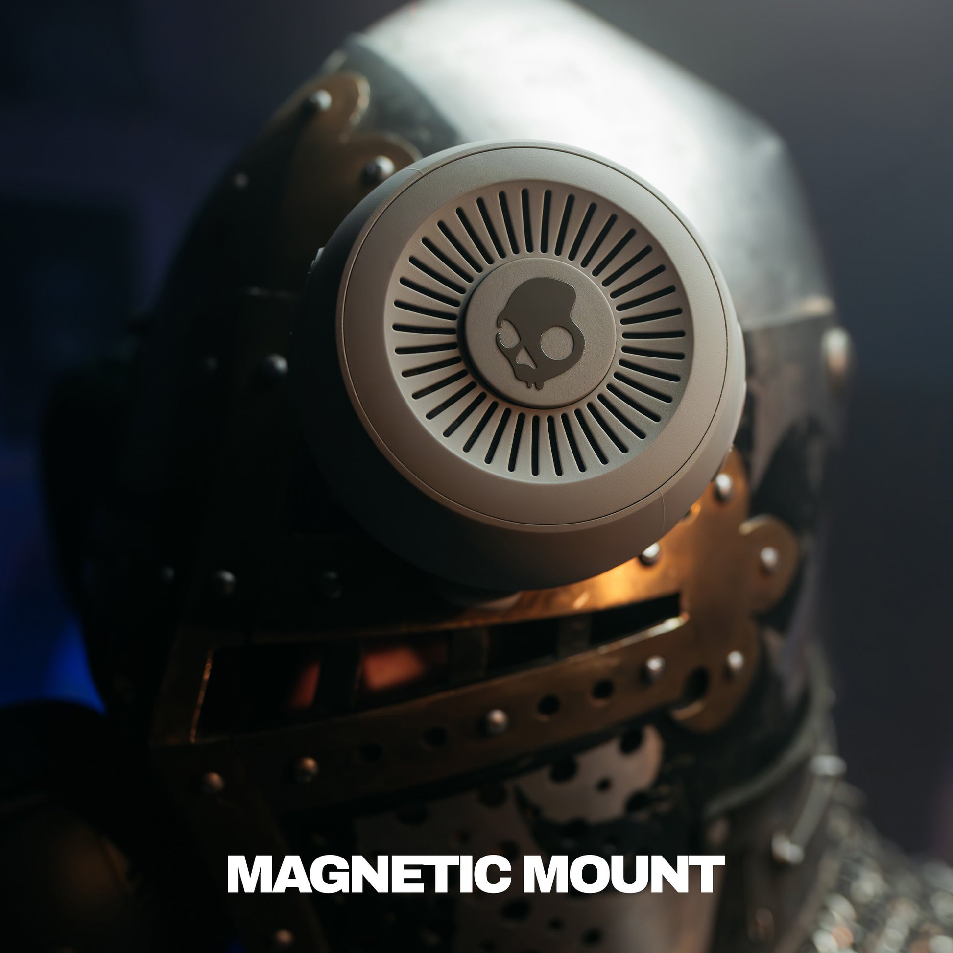 Metallic helmet with a speaker labeled 'Magnetic Mount' on a dark background | Cement
