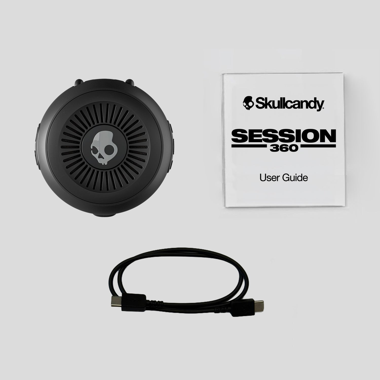 Skullcandy Session 360 headset with user guide on a light gray background | Plasma