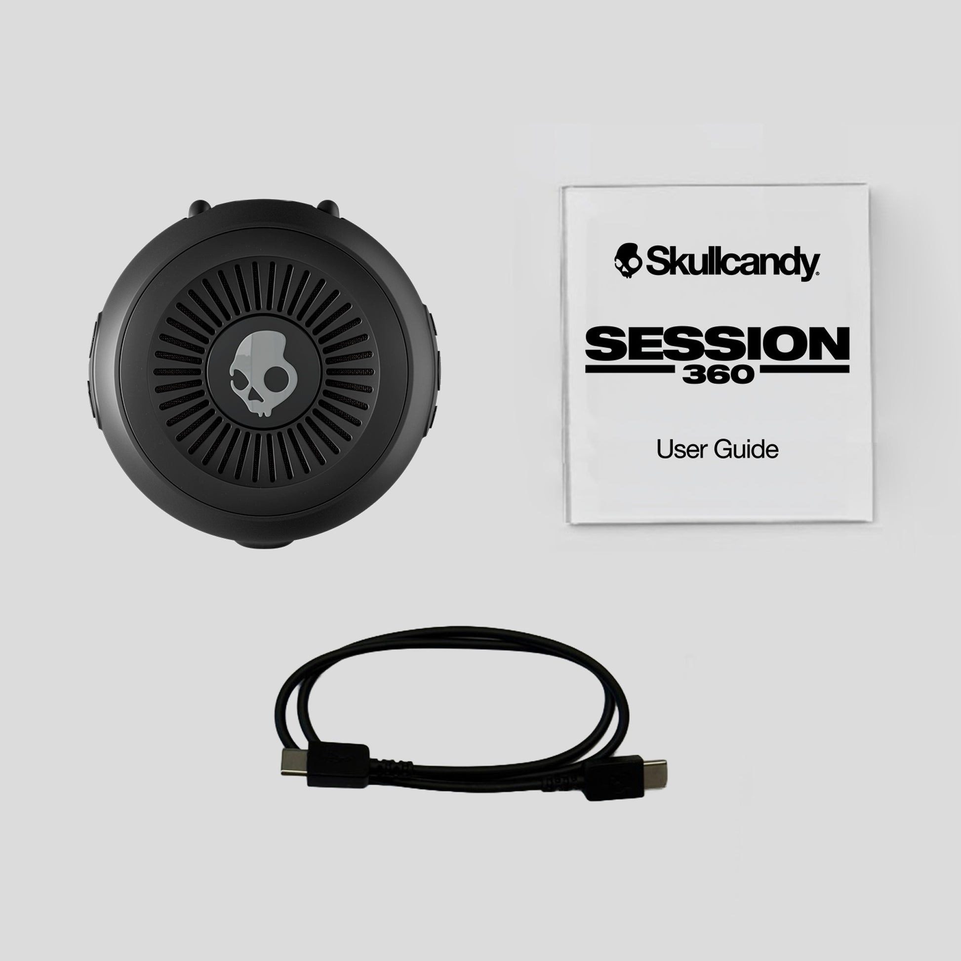 Skullcandy Session 360 headset with user guide on a light gray background | Plasma
