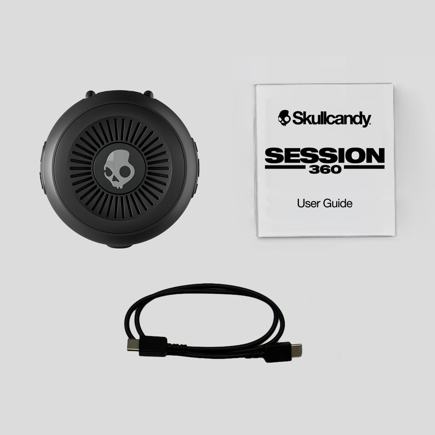 Skullcandy Session 360 headset with user guide on a light gray background | Primer