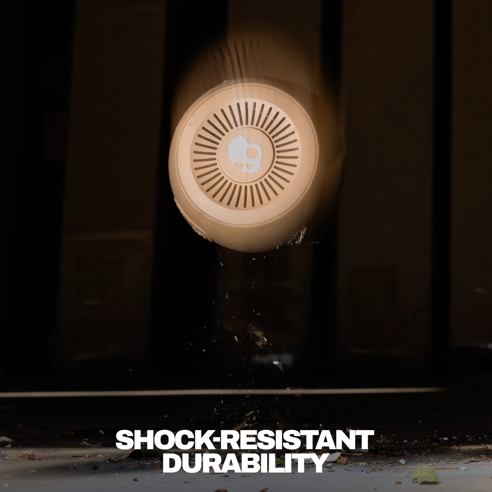 Round shockproof device with 'Shock-Resistant Durability' text on a dark background | Primer