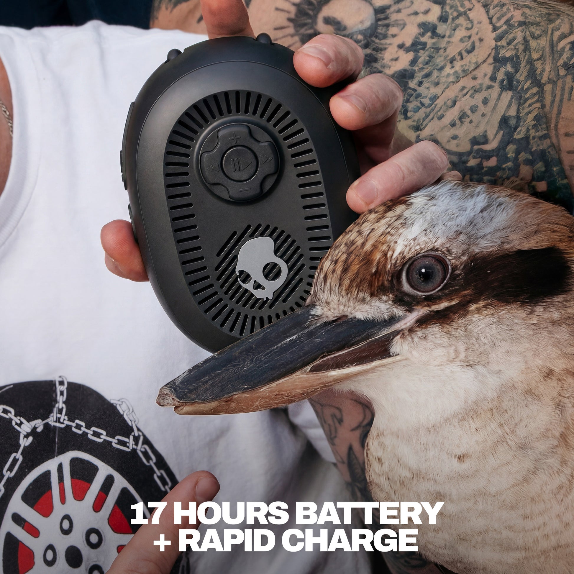 Person holding a black speaker with a bird close by, emphasizing battery life and rapid charge feature. | True Black
