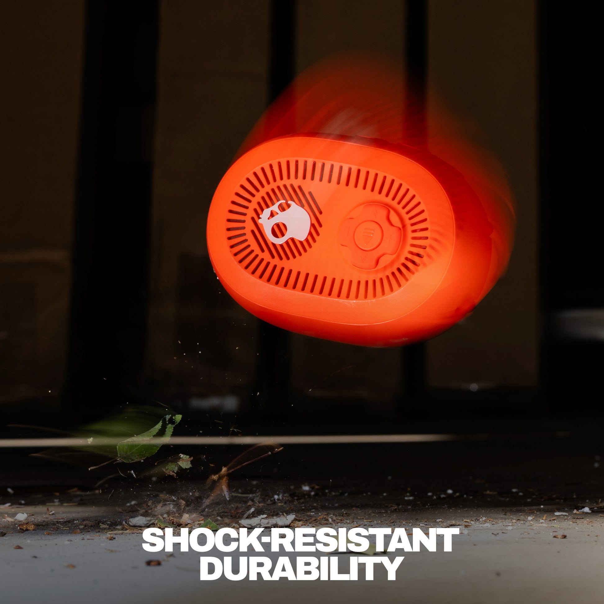 Red speaker with 'Shock Resistant Durability' text on a dark background | Plasma