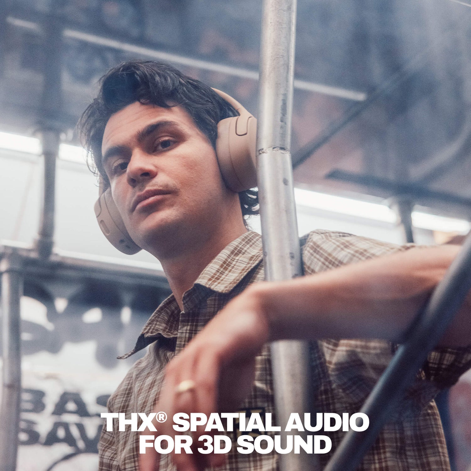 Person wearing Crusher 720 headphones with 'THX Spatial Audio FOR 3D Sound' branding in a blurred urban setting | Primer